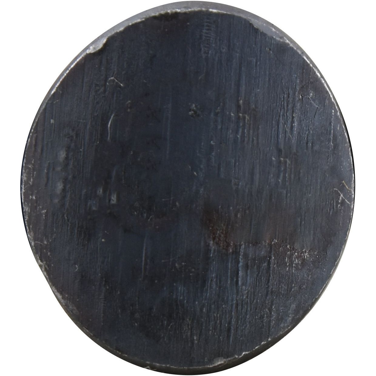 Close-up of a round, unevenly surfaced, and scratched black object, possibly resembling a stone or metal puck with characteristics similar to an 8.8 tensile strength Sparex Oval Head Bolt Square Collar With Nut (TOCC) - M10 x 38mm (Sparex Part No. S.78770), against a white background.