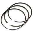 The Sparex Piston Ring set (Part No. S.42939) includes three piston rings arranged in a circular shape, one of which features a toothed pattern along its edge. This RING SET is designed for Massey Ferguson and has a chrome plated barrel for enhanced durability.