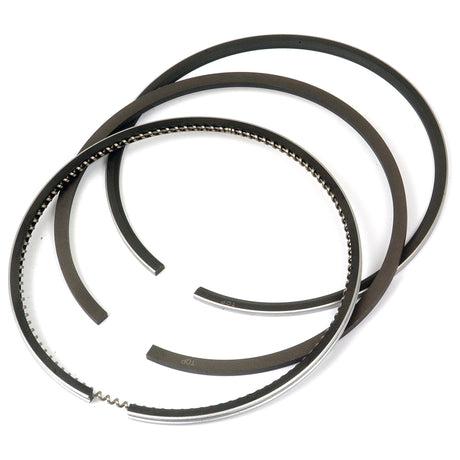 The Sparex Piston Ring set (Part No. S.42939) includes three piston rings arranged in a circular shape, one of which features a toothed pattern along its edge. This RING SET is designed for Massey Ferguson and has a chrome plated barrel for enhanced durability.
