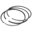 Image of three Sparex Piston Rings (Sparex Part No. S.62029) arranged close to each other, showcasing their open ends and the textured inner surface of one chrome-plated ring.