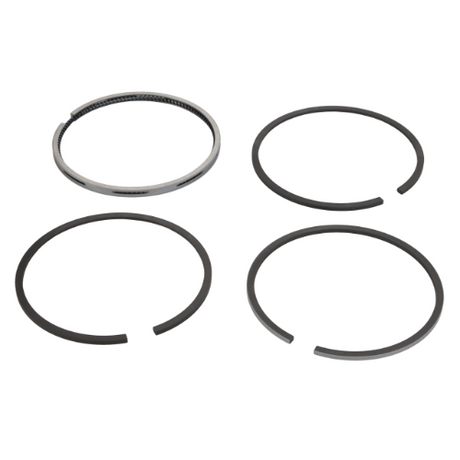 A Massey Ferguson - Piston Ring Set - 745826M91 by AGCO, featuring four metal rings of varying designs and sizes, is meticulously arranged in a square pattern against a plain white background.