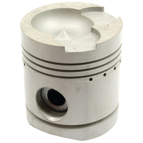 A close-up shot of the Sparex Piston (Standard) - S.56934, showcasing its metallic structure with a groove on top, a central hole, and several thin horizontal indentations around its circumference, reveals the precision in its piston length.