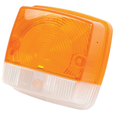 Close-up of a rectangular Sparex Hella front light cover, model S.56133, with an orange and white design featuring a circular pattern on the orange section. Perfect as a Replacement Lens, Sparex Part No.S.56190.
