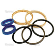 The Seal Kit (Sparex Part No. S.57948) by Sparex features an assortment of rubber and fabric rings, including two blue rings, two gold fabric rings, and four black rings, all neatly arranged on a plain white background next to a small cylinder.