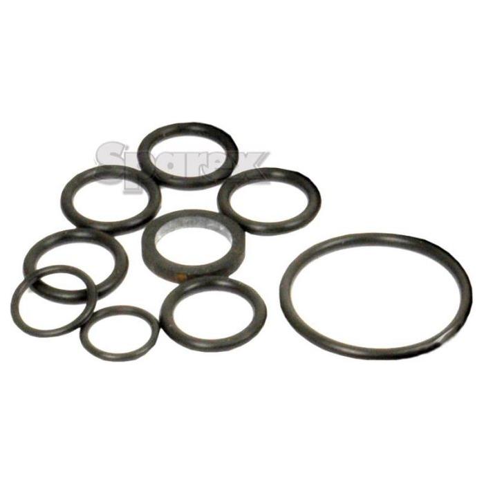 Here is a Seal Kit by Sparex (Part No.S.58774), featuring circular metal washers in various sizes, ideal for repairing Ford New Holland tractor models, arranged on a plain surface.