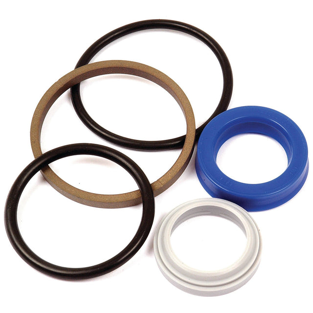 The Sparex Seal Kit (Steering Cylinder), Part No. S.65088, includes an assortment of rubber and plastic O-rings in various sizes and colors such as black, brown, blue, and white. These components are displayed on a white background and are ideal for maintaining your Farmall or Case IH steering cylinder.
