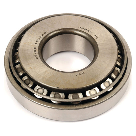 Close-up of a metallic tapered roller bearing with a visible inner and outer ring, marked with text including "Japan," "Sparex," and part number "4T-55175C/55437.