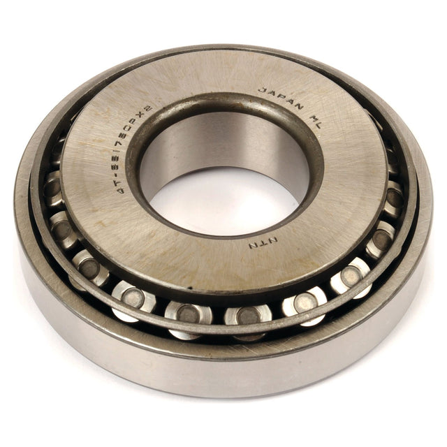 Close-up of a metallic tapered roller bearing with a visible inner and outer ring, marked with text including "Japan," "Sparex," and part number "4T-55175C/55437.