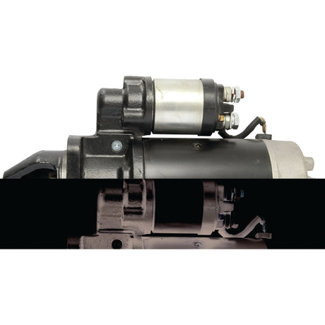 Close-up of the Sparex Starter Motor - 12V, 2Kw (Sparex Part No.S.359831) with a focus on the solenoid components, shown from different angles. The upper section is brightly lit, while the lower section is dimly lit.