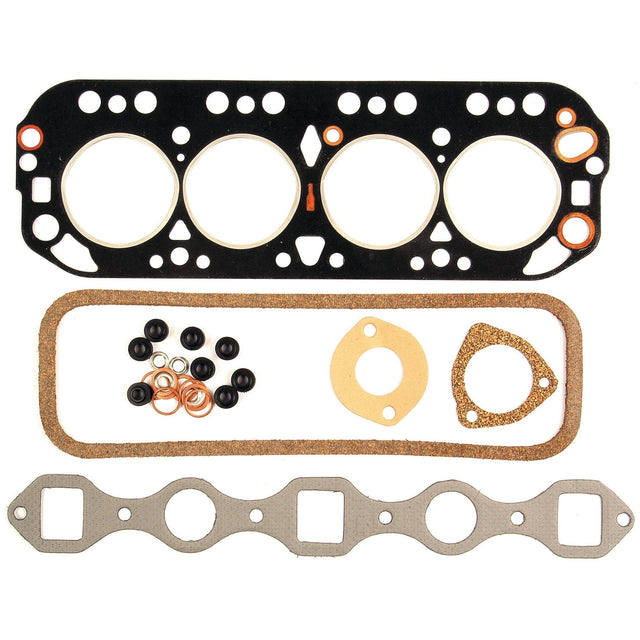 A variety of gaskets, including a head gasket, exhaust manifold gasket, and smaller gaskets and seals, arranged on a white background; this Sparex Top Gasket Set - 4 Cyl. (4.154, L154) | Sparex Part No.S.58729 is ideal for Leyland 154 with 4 Cyl. engines.