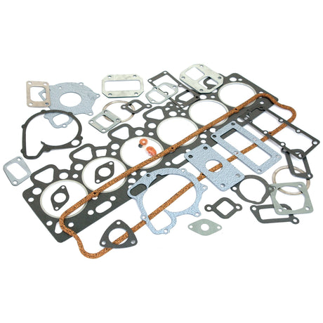 A variety of engine gaskets and seals are arranged on a white background. The set includes different shapes and sizes for various engine components, perfect for a 6 Cylinder Massey Ferguson. This Top Gasket Set - 6 Cyl., known as Sparex Part No.S.40598, ensures optimal performance for your machinery.