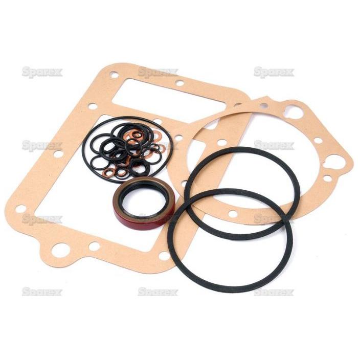 The Sparex Transmission Gasket Set (Part No. S.42839) features a variety of rectangular and circular gaskets and O-rings, meticulously arranged on a white surface—perfect for transmission repairs in Massey Ferguson machinery.