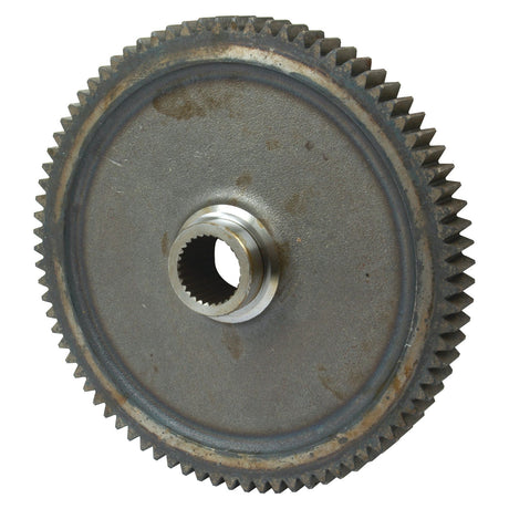 A close-up image of the Transmission Gear PTO - S.65350 from Sparex shows a metal gear with teeth splines along its edge and a central hole for mounting, exhibiting signs of wear from use.