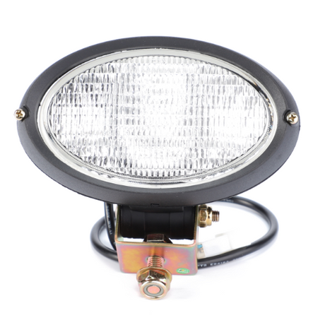 A close-up of the Massey Ferguson Worklight Front - 3786668M93 by AGCO, showcasing its oval-shaped, black and silver headlight design complete with a metal mounting bracket and attached wiring, perfect for the 1000 Series Massey Ferguson tractor parts.