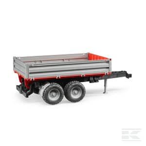 The Bruder Tipping Trailer U02019 is a small, silver and red utility trailer with two wheels and a hitch for towing, perfect for 1:16 scale models used in agriculture.