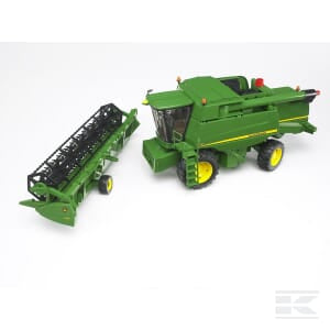 A green Bruder John Deere Combine Harvester T670i - U02132 toy with a detachable header attachment placed to its left on a white background.