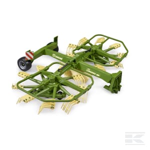 The Whirl rake - U02216 by Bruder is a green and yellow agricultural machine designed for gathering hay or other crops. It features multiple rakes and a set of wheels on one end for easy maneuvering.