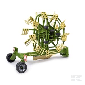 Introducing the Whirl rake - U02216 by Bruder, a green agricultural machine equipped with multiple rotary rake structures designed for collecting or handling crops, and mounted on wheels for easy mobility.