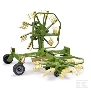 A green agricultural machine, identified as the Bruder Whirl rake - U02216, featuring multiple rotating arms and tines likely used for raking or sorting, is shown against a plain white background.