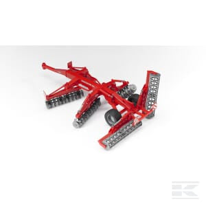 A Kuhn Discover XL - U02217 by Bruder, featuring a red agricultural disc harrow with large wheels and metal blades designed for tilling soil, displayed on a white background.