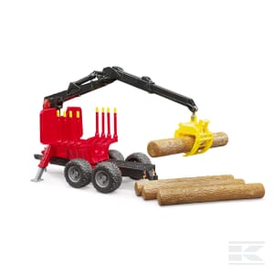 A Bruder Logging trailer (model U02252), featuring a 1:16 scale red body and black crane arm lifting a wooden log. Additional logs are stacked on the ground nearby, complemented by a plastic trailer to enhance its realistic forestry application.