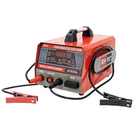 The SIP STARTMASTER DSC200B Digital Starter Charger is shown. This red and black Lithium-Ion Battery Charger, model IP-03584, is designed with versatility in mind and features clamps and cables, a handle on top, and a display panel on the front.