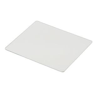 A rectangular, flat, clear glass pane with lightly rounded corners placed on a white surface, resembling the Draper Outside PC Lens for use with welding helmets (Stock No. 02512 - AWHVS-BK-LO).