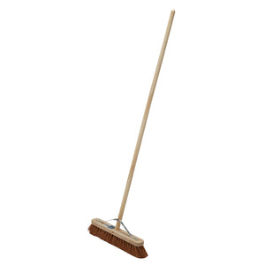 The Draper Soft Coco Broom, 450mm - PBRM/COCOE features a long wooden handle with soft brown bristles angled against a white background. It's perfect for both indoor and outdoor use.