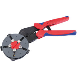 The Draper Knipex Multicrimp Crimping Plier - 97 33 02 is a red and black hand crimper tool with a circular rotating die head, designed for crimping wires or terminals, and features interchangeable dies.