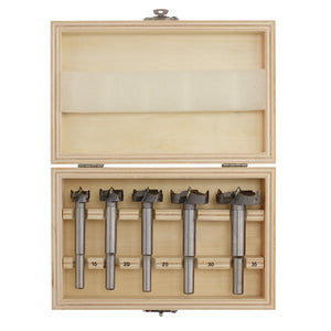 A wooden box containing the Draper Forstner Drill Bit Set (5 Piece) - FBS05, each labeled with their respective sizes: 15, 20, 25, 30, and 35 millimeters. The box is open, displaying the tungsten carbide tipped bits neatly organized in individual slots.