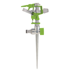 The Draper Adjustable Impulse Sprinkler - ISP is a green and metallic garden sprinkler featuring a pointed spike for ground insertion. It boasts an adjustable spray nozzle on the sprinkler head to control the spray distance and comes with a threaded water connection valve, making it compatible with standard garden hose fittings.