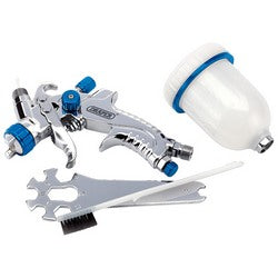 The Draper Gravity Feed HVLP Air Spray Gun, model GSG5-100, boasts a sturdy aluminum body with blue accents. It includes a white plastic paint cup, a cleaning brush, and a multi-tool for easy maintenance.