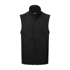 The Fort Breckland Softshell Bodywarmer Black by Cottonmount is a black, sleeveless vest featuring a high collar and front zipper closure. This fleece-lined bodywarmer includes pockets on both sides and has a visible green tag inside the collar.