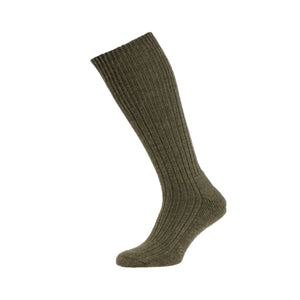 A single HJ Wool Rich Commando Sock in Olive Green from Cottonmount, featuring a ribbed design and knee-high length, is displayed against a white background.