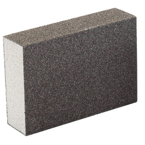 A Draper Flexible Sanding Sponge, Fine/Medium Grit - SP100FM, featuring a coarse, dark grey surface and a white interior, is displayed against a white background, resembling the texture of an abrasive grit.