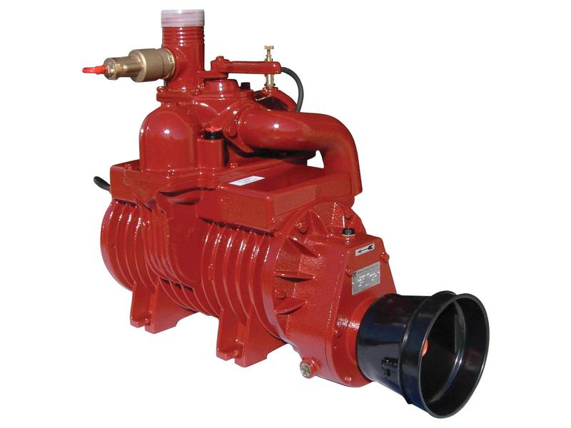 The Sparex vacuum pump MEC6500M, PTO driven with 540 RPM, known also by Sparex Part Number S.101801 and To fit ID 9000600001, stands out for its reliability with its red industrial design featuring a large intake along with several valves and pipes attached.