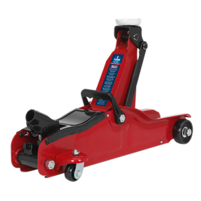 The Sealey Trolley Jack 2 Tonne Low Profile Short Chassis - 1050CXLE is a red hydraulic floor jack with black accents, ideal for lifting vehicles. It comes equipped with a handle, wheels for easy mobility, and a one-piece hydraulic unit. The blue label denotes its 2-ton lifting capacity, making it perfect for sports and custom cars due to its low entry lifting range.