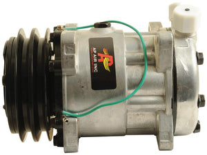 Image of a silver Sparex Compressor (SD7H15) with black belt pulleys and a label reading "AP AIR INC." A green wire is connected to the compressor's clutch.