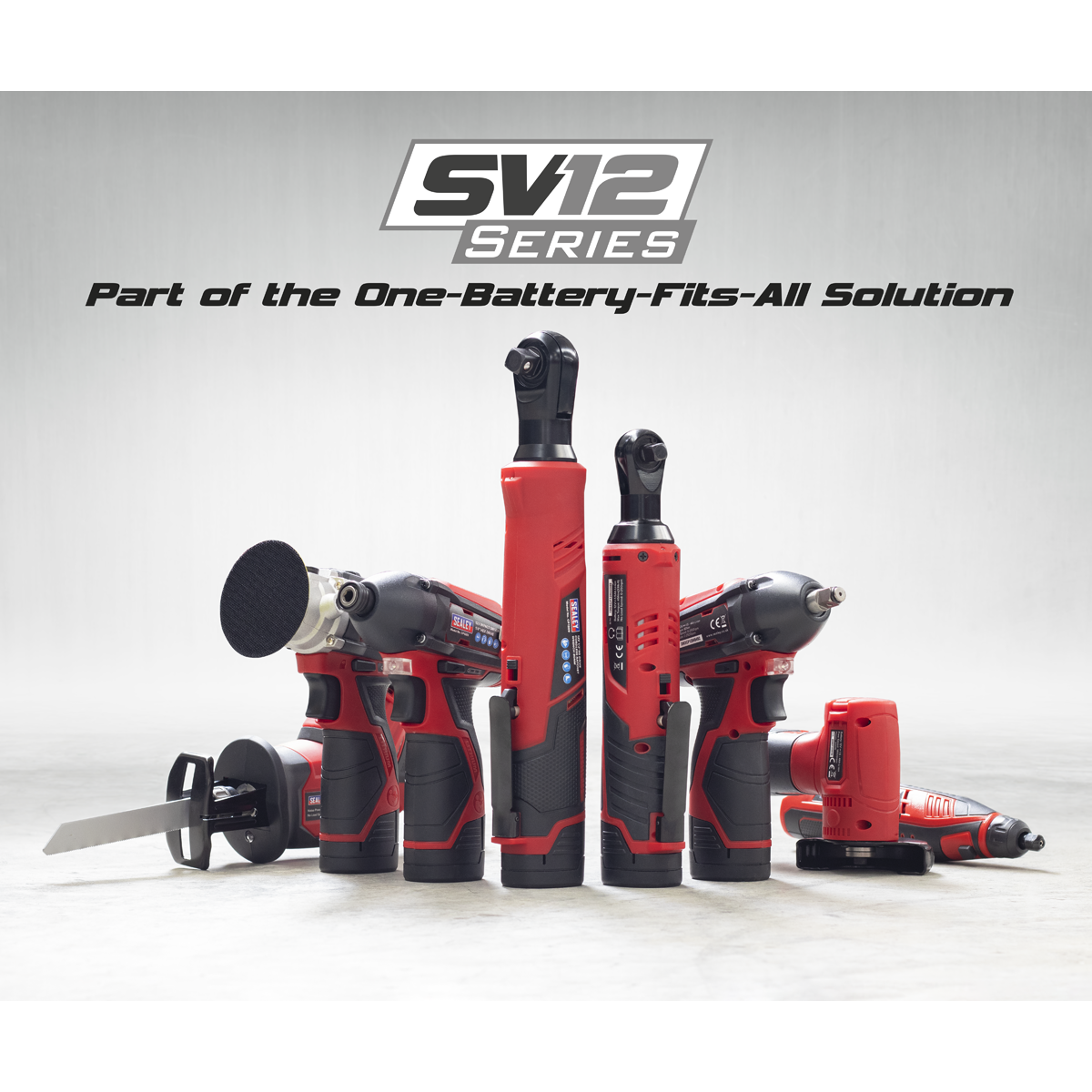 A lineup of red and black power tools, featuring a compact design and powered by lithium-ion batteries, under the text "Sealey Cordless Ratchet Wrench Kit 1/2"Sq Drive 12V SV12 Series - Part of the One-Battery-Fits-All Solution" on a grey background.