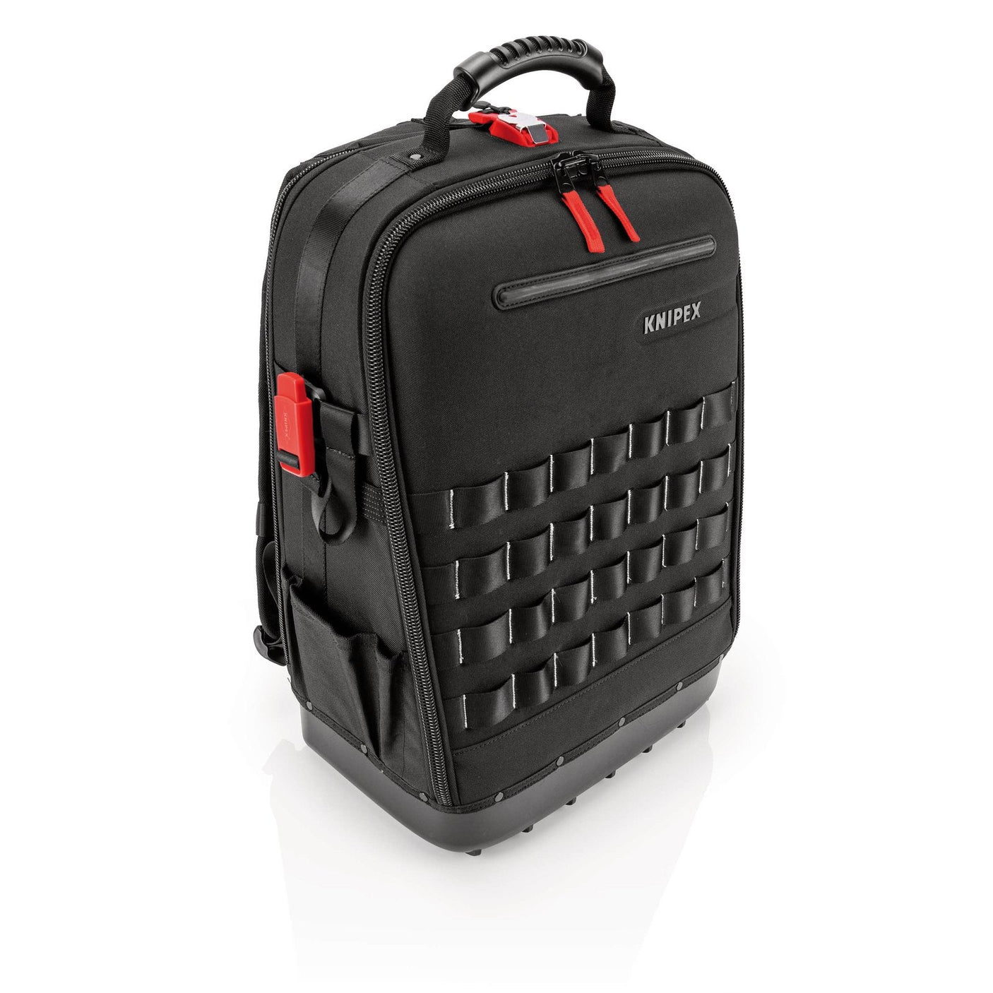 A Draper Knipex 00 21 50 S Tool Backpack Modular X18 Plumbing in black with red accents, featuring MOLLE webbing, a rigid bottom, multiple exterior pockets, FIDLOCK connectors, and a top handle for carrying.