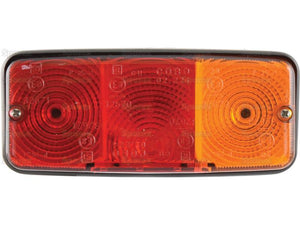 Introducing the Sparex Rear Combination Light (Halogen) featuring a rectangular vehicle tail light with three sections: two red halogen brake/tail lights on the left and center, and one amber indicator light on the right. This IP55-rated rectangular tail light ensures durability and reliability in diverse conditions. Suitable for both 12V and 24V systems, it is identified by Sparex Part Number S.138003.