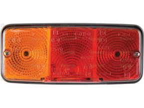 The Sparex Rear Combination Light (Halogen) features three distinct sections: an amber indicator light on the left, a white light in the center, and a red brake/tail light on the right. This left-hand (LH) 12/24V light serves multiple functions including brake, tail, and indicator lighting. The Sparex Part Number is S.138005.