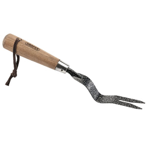 Introducing the Draper Carbon Steel Heavy Duty Hand Weeder With Ash Handle, 125mm - A3093/I: This hand-held weeding tool features a lacquered ash handle, a two-pronged carbon steel fork, and an attached leather strap for convenient hanging.