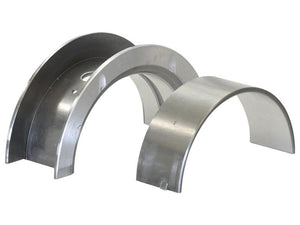 Two curved metal shims of different sizes, resembling elements from a thrust bearing assembly, are placed side by side on a white background.