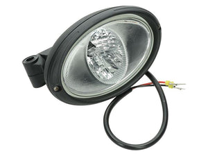 The Sparex Work Light (Halogen), Oval, LH, 12/24V (Sparex Part Number: S.147653) features a clear lens and black casing, expertly designed for durability as a worklight. It includes attached wires with bare ends for convenient connection and is rated IP65, offering superior resistance to dust and water.