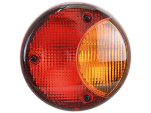 The Sparex Rear Combination Light (Halogen) with Sparex Part Number S.151640 is a round vehicle tail light lens featuring red and amber sections under a clear cover. It is secured by four screws and includes a replacement bulb for optimal visibility at 12V, suitable for various functions on the right-hand side of your vehicle.