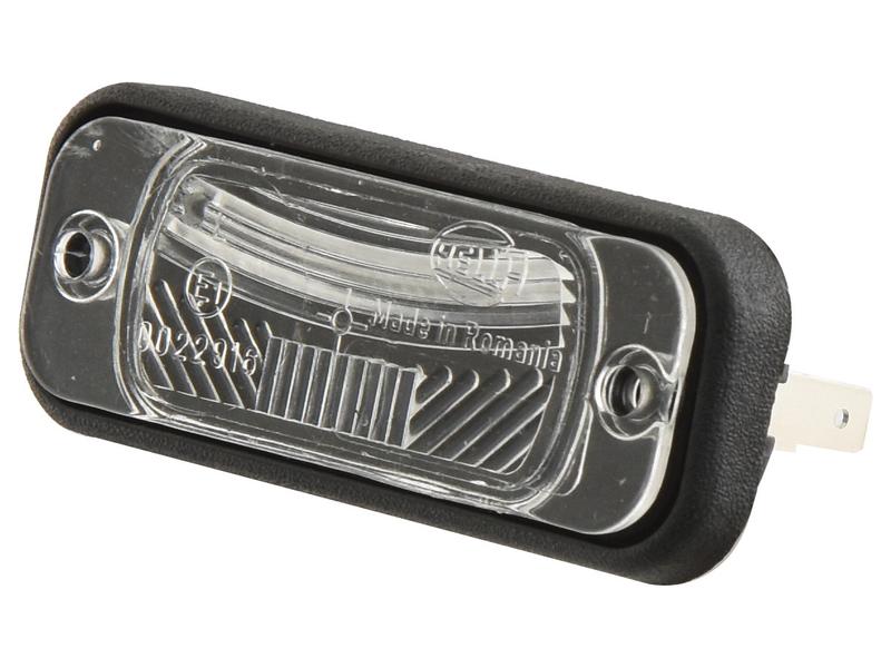 Close-up of the Sparex Number Plate Light (Halogen), 12V, RH & LH, with a rectangular shape featuring a clear lens and black border. The internal design details are showcased alongside the "Made in Romania" engraving. Inside, a Hella Bulb enhances brightness while the spade terminal connection guarantees reliable performance. The light corresponds to Sparex Part Number: S.151678.