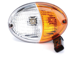 A close-up of a Sparex Front Combination Light (Halogen), 12V, RH & LH, featuring an oval design with a clear white section and an amber-colored section, along with a wiring connector at the bottom, designed to meet IP54 standards. This light is listed under Sparex Part Number S.151748.