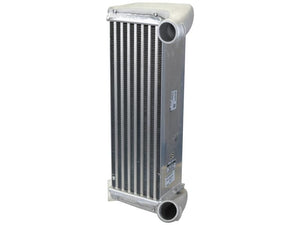 The Sparex Radiator (Part Number: S.156148) boasts a rectangular shape with a silver finish, featuring multiple fins and two circular pipe connectors strategically placed at the top and bottom. It includes an inlet on the top and an outlet on the bottom, ensuring reliable performance.