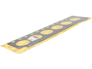 A rectangular mild steel automotive head gasket for BF6M 2012 Deutz engine parts, featuring multiple circular holes and partially wrapped in yellow packaging with a label, by Sparex. This product is known as Head Gasket - 6 Cyl. (BF6M 2012) and has the Sparex Part Number S.163368.